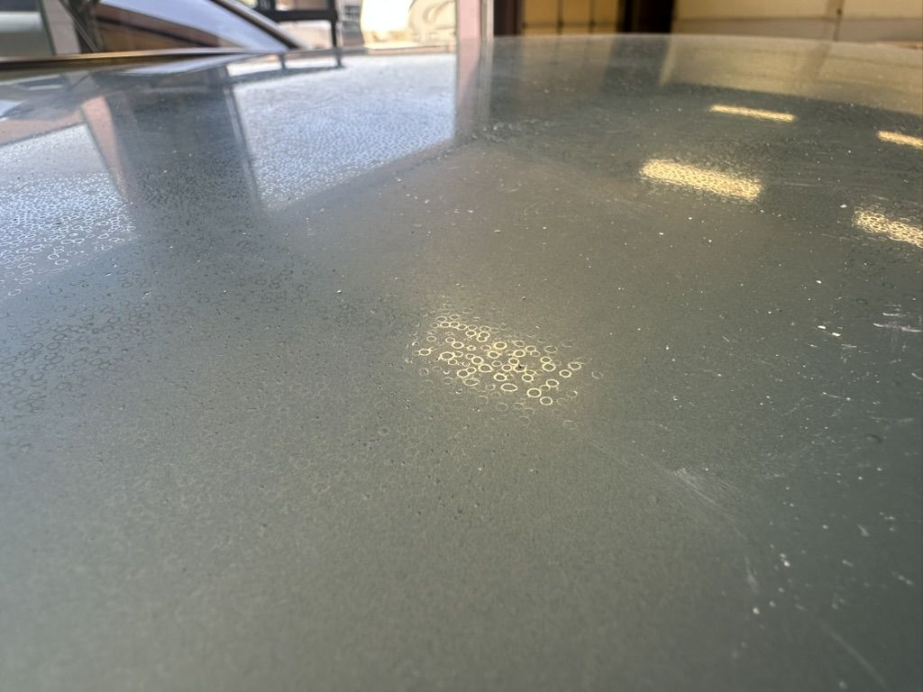 Hard-water spots and etching across the 280Z roof before refinishing