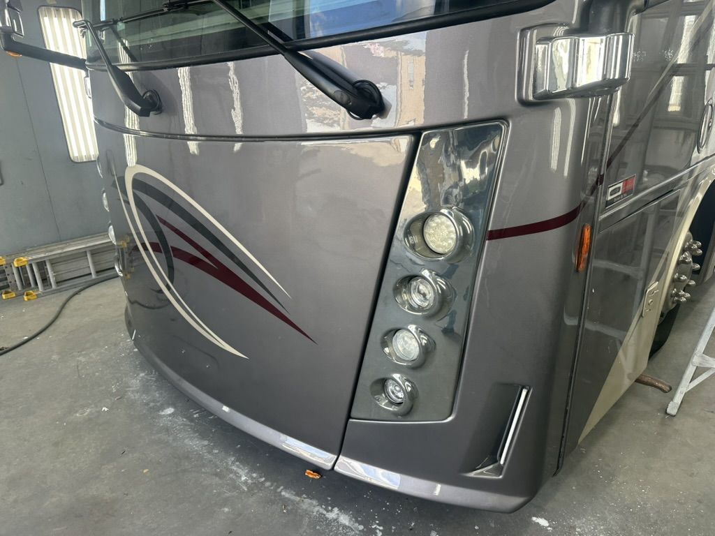 The same motorhome front corner after AeroArmor Paint Shield with a deep gloss finish