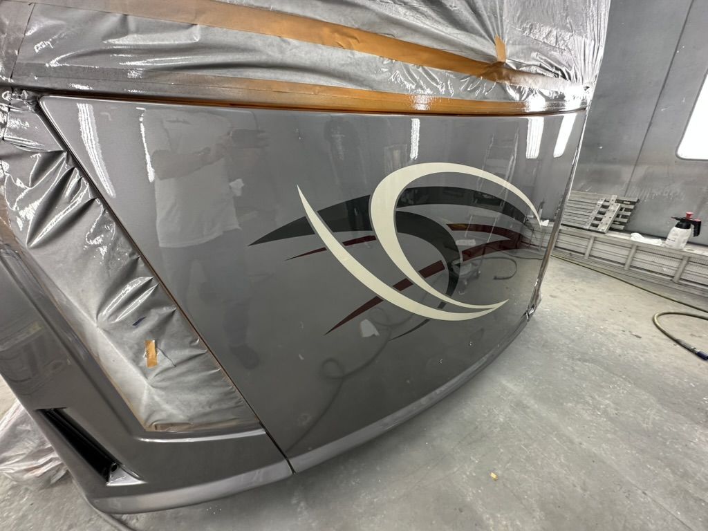Close-up of the mirror-gloss finish on the motorhome front cap