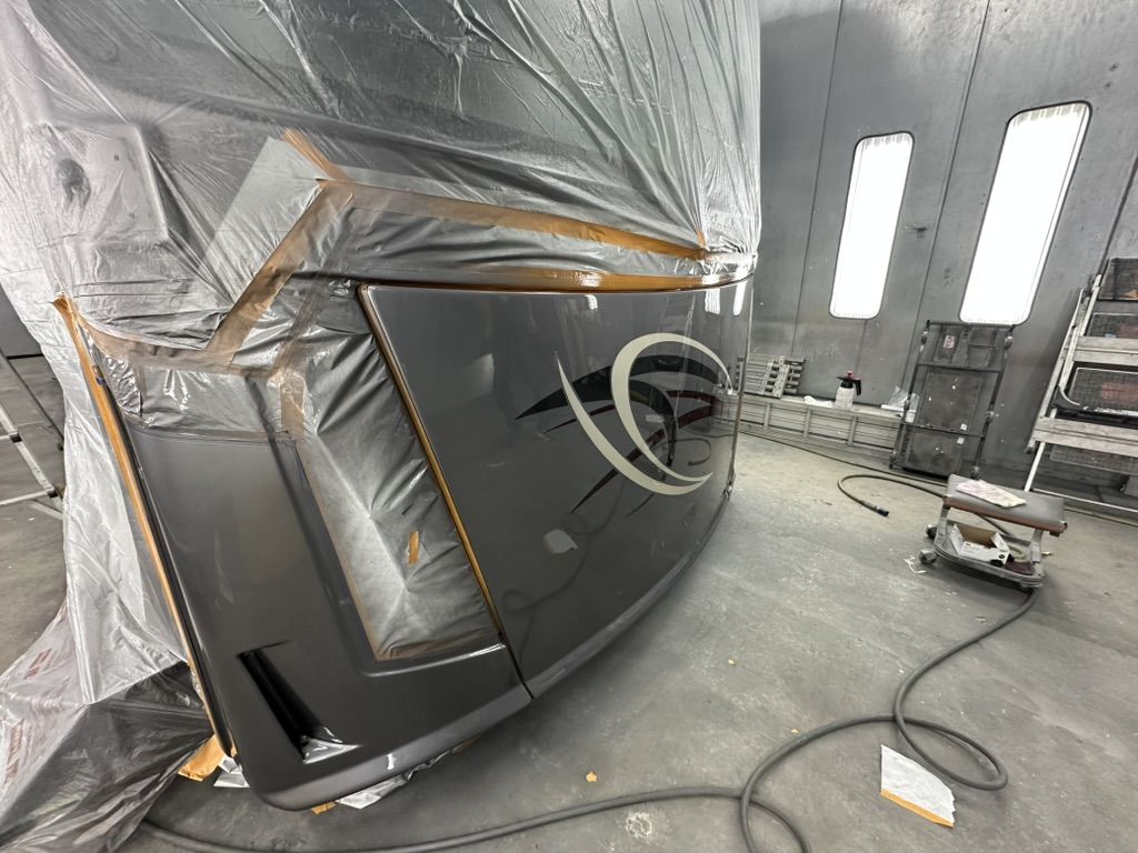 Side angle of the glossy motorhome front cap in the paint booth