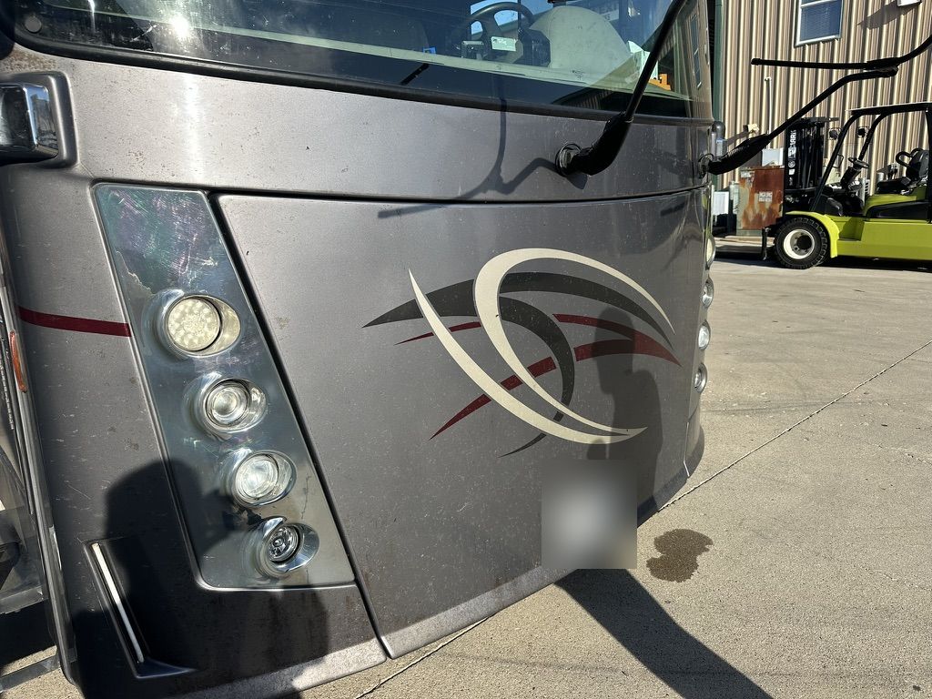 Class A motorhome front cap before service: dull, stained paint under aging Diamond Shield film
