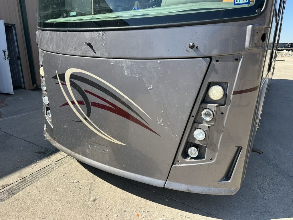 Motorhome front cap in prep with lights removed and old film coming off