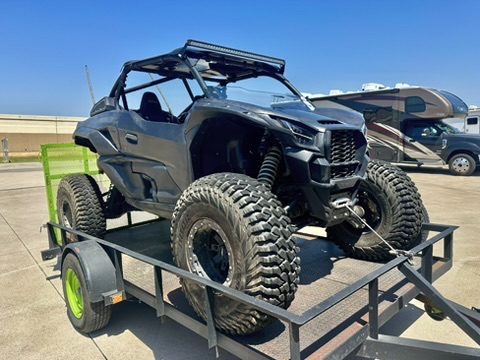 Kawasaki Teryx KRX before service: faded, scratched black body panels