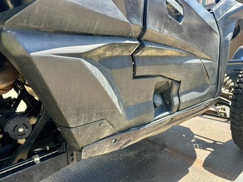 Scratched and scuffed UTV rocker panel before service